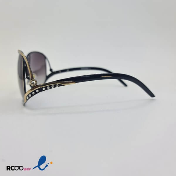 عکس از عینک آفتابی پلاریزه زنانه با فریم بیضی و نگین دار و دسته خاص مدل 1005