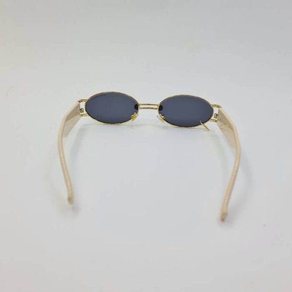 عکس از عینک آفتابی پیرسینگ دار جنتل مانستر با دسته کرمی مدل 8036
