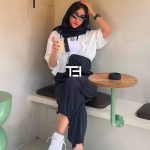 عکس از عینک آفتابی مستطیلی شکل و دسته سه بعدی برند پرادا Prada بر روی صورت
