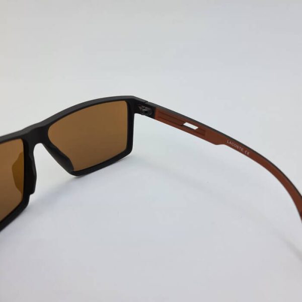 عکس از عینک آفتابی برند لاگوست با فریم و عدسی قهوه ای با فریم کائوچو مدل 2162