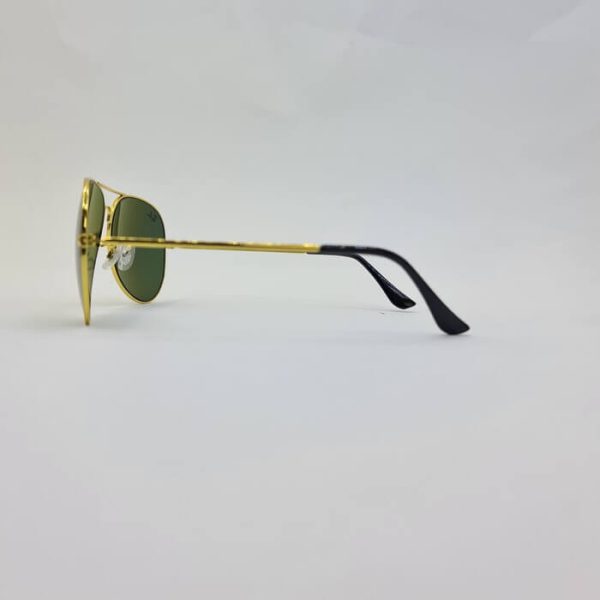 عکس از عینک آفتابی خلبانی اورجینال برند ریبن با فریم طلایی و لنز سبز مدل bl3026