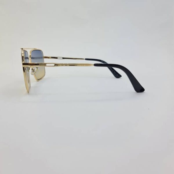 عکس از عینک شب با لنز دو رنگ آبی و قهوه ای و فریم طلایی برند میباخ مدل n2001