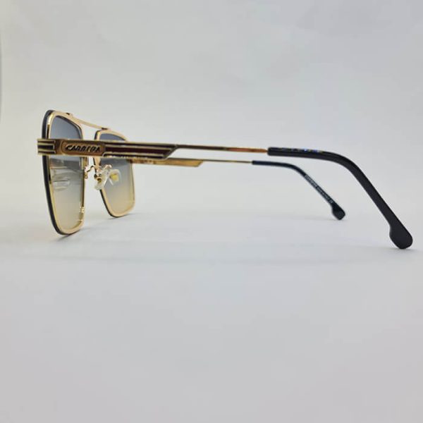 عکس از عینک آفتابی برند کررا با فریم طلایی و مربعی شکل و عدسی دو رنگ مدل 0270