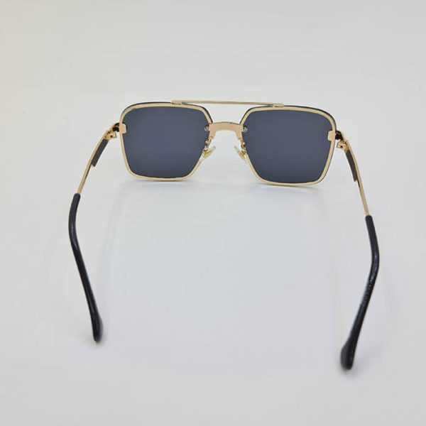 عکس از عینک دودی با فریم طلایی و مربعی شکل و عدسی تیره برند carrera مدل 0270