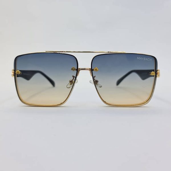 عکس از عینک آفتابی میباخ maybach با فریم مربعی و طلایی و دسته مشکی رنگ با عدسی دو رنگ مدل 236