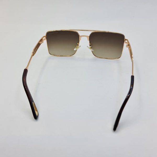 عکس از عینک افتابی با فریم طلایی و دسته طرح دار و لنز قهوه ای میباخ مدل 10495
