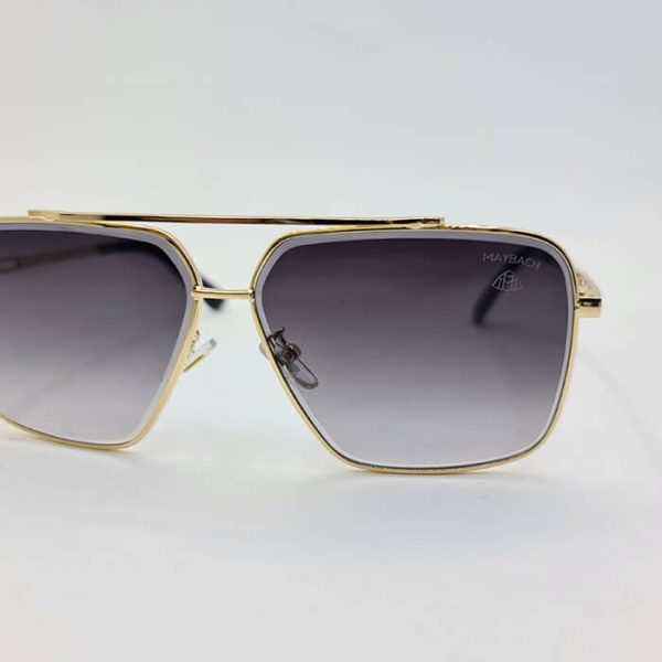 عکس از عینک دودی میباخ با فریم طلایی و مربعی شکل و عدسی سایه روشن مدل n2001