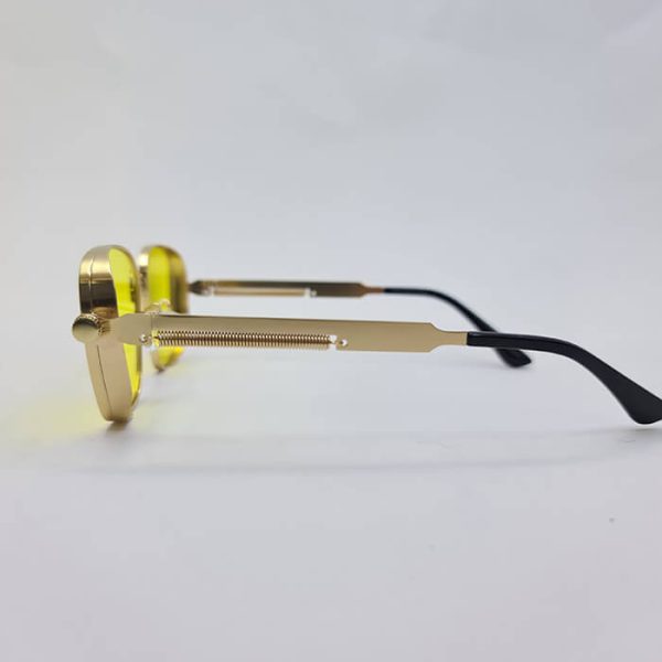 عکس از عینک شب با طرح پیچ و فنر، فریم طلایی رنگ و عدسی زرد رنگ مدل 538