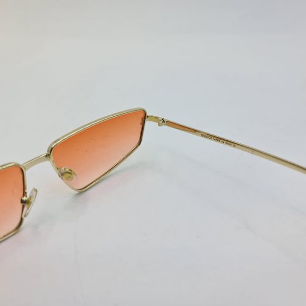 عکس از عینک فانتزی برند gucci با فریم طلایی فلزی و عدسی نارنجی مدل 003