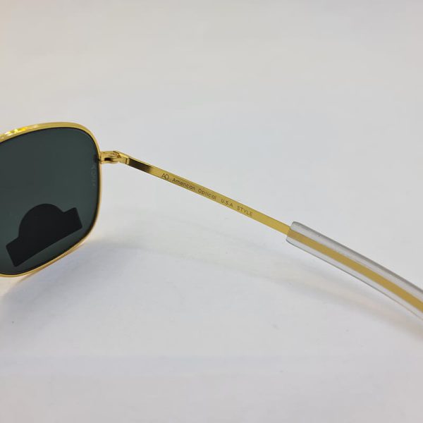 عکس از عینک دودی با لنز شیشه نشکن برند امریکن اپتیک و فریم طلایی مدل cao2