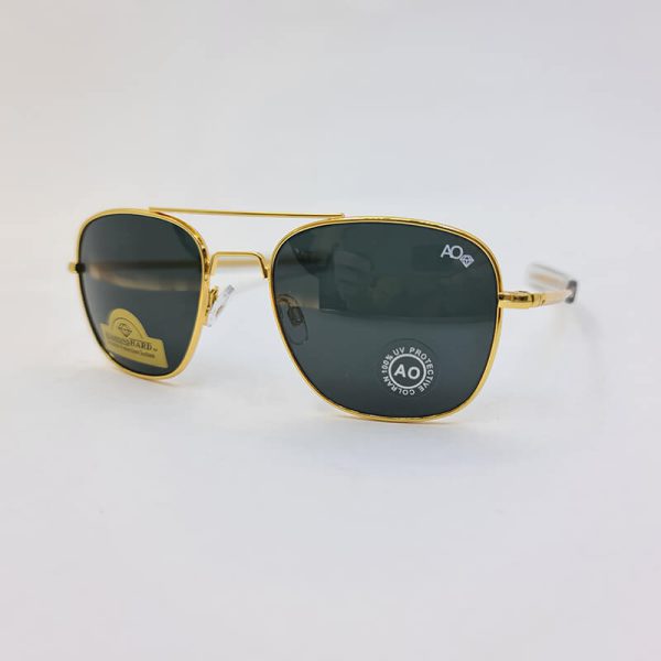 عکس از عینک دودی با لنز شیشه نشکن برند امریکن اپتیک و فریم طلایی مدل cao2