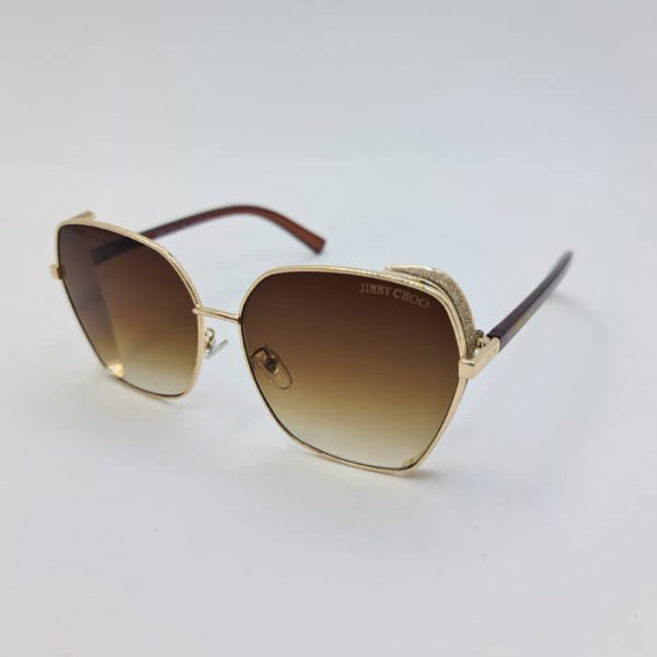 عکس از عینک آفتابی شاین دار با فریم طلایی و عدسی قهوه ای رنگ مدل 28011
