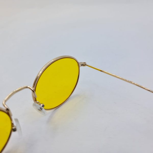 عکس از عینک شب بیضی شکل با فریم طلایی و عدسی زرد دیتیای مدل 3612