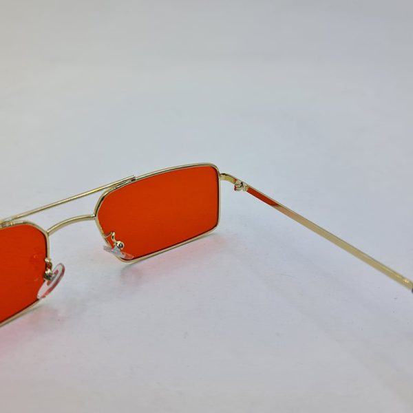 عکس از عینک شب با فریم مستطیلی، طلایی رنگ و لنز قرمز برند دیتیای مدل 9549