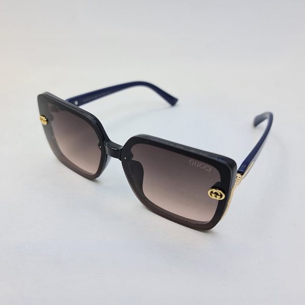 عکس از عینک آفتابی با فریم مشکی رنگ و دسته آبی و عدسی قهوه ای برند گوچی مدل 6031