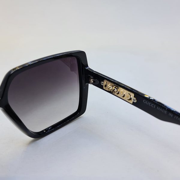 عکس از عینک آفتابی گوچی با فریم و دسته مشکی رنگ و عدسی سایه روشن مدل 6062