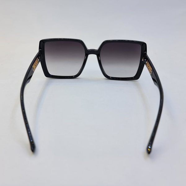 عکس از عینک آفتابی گوچی با فریم و دسته مشکی رنگ و عدسی سایه روشن مدل 6062