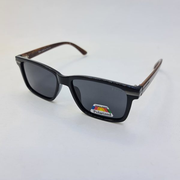 عکس از عینک آفتابی پلاریزه dior با فریم مشکی و دسته قهوه ای رنگ طرح چوبی مدل 4012