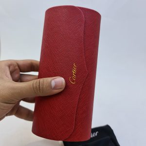 عکس از پک اورجینال عینک برند کارتیه Cartier قرمز رنگ و با تمام تجهیزات مدل 991907