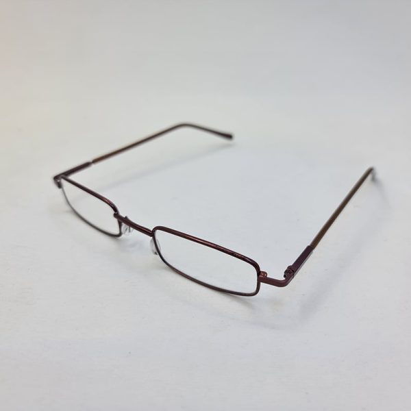 عکس از عینک مطالعه با نمره چشم 1. 00 و طرح خودکاری و قاب قهوه ای و زرد