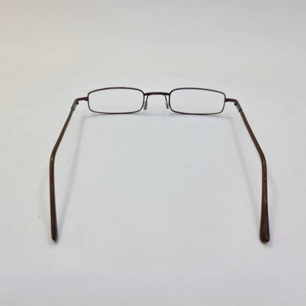 عکس از عینک مطالعه با نمره چشم 1. 75 و طرح خودکاری و قاب قهوه ای و زرد