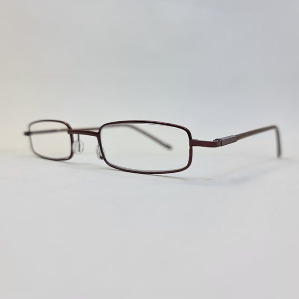 عکس از عینک مطالعه با نمره چشم 4. 00 و طرح خودکاری و قاب قهوه ای و زرد