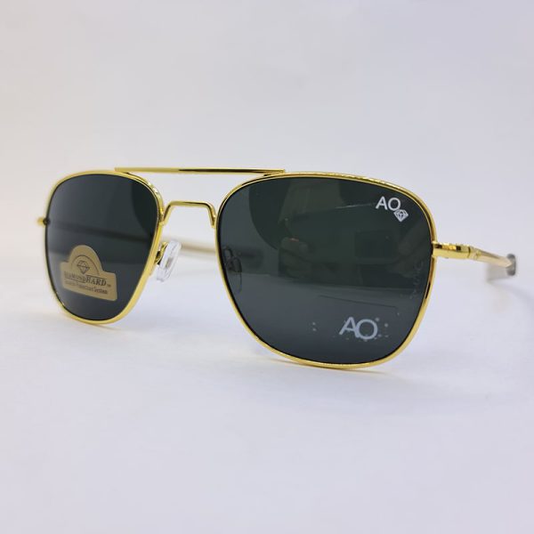 عکس از عینک دودی امریکن اپتیکال با عدسی سنگ و آنتی رفلکس و فریم طلایی رنگ مدل sky