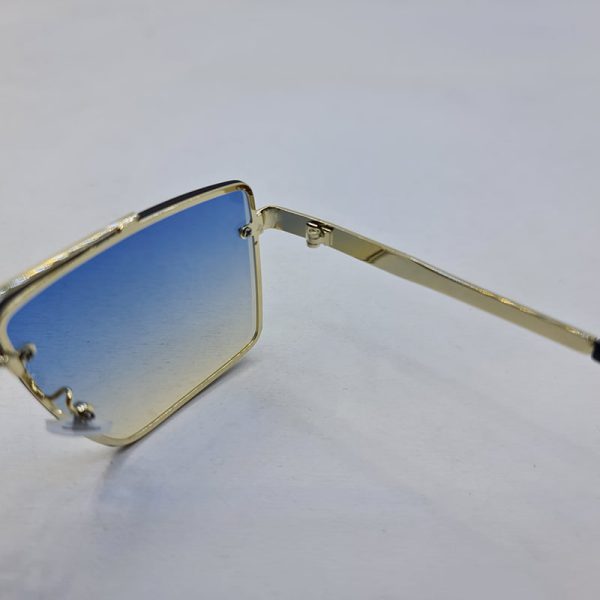 عکس از عینک آفتابی ditiai با فریم طلایی رنگ و لنز آبی سایه روشن مدل 9683