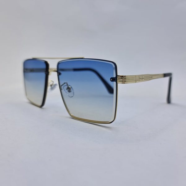 عکس از عینک آفتابی ditiai با فریم طلایی رنگ و لنز آبی سایه روشن مدل 9683
