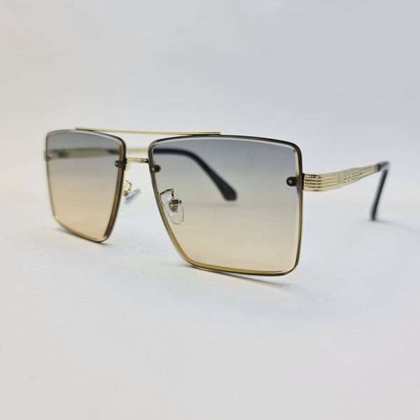 عکس از عینک آفتابی دیتیای با فریم طلایی و عدسی دو رنگ دودی و قهوه ای مدل 9683