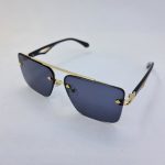 عکس از عینک آفتابی میباخ با فریم طلایی، دسته مشکی و عدسی دودی مدل GZ1290