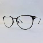 عکس از عینک طبی گرد مشکی رنگ با دسته نقره ای مدل 885232