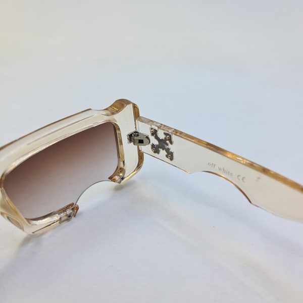 عکس از عینک آفتابی اف وایت با فریم شفاف و لنز قهوه ای سایه روشن و فانتزی مدل 22030