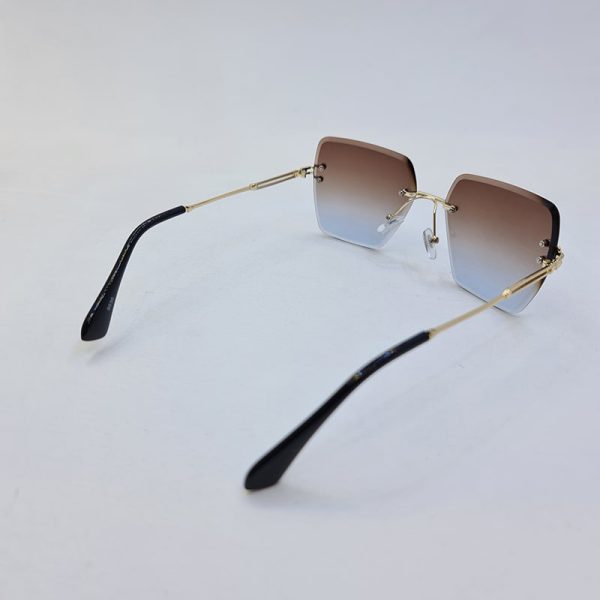 عکس از عینک آفتابی فریم لس برند دیتیای با لنز دو رنگ (قهوه ای و آبی) مدل 9530