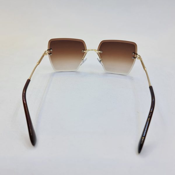عکس از عینک آفتابی فریملس برند ditiai با لنز هایلایت قهوه ای و دسته طلایی مدل 9530
