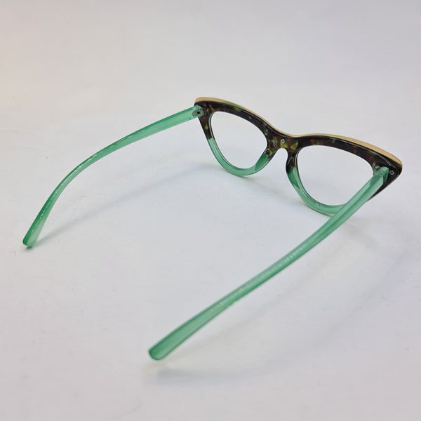 عکس از فریم عینک طبی گربه ای با رنگ سبز، مشکی و طلایی برند گوچی مدل g10a