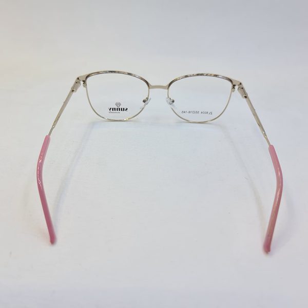 عکس از عینک طبی گرد طلایی و صورتی رنگ با دسته فنری و فریم فلزی مدل 5004