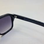 عکس از عینک آفتابی MOSCOT با فریم مربعی شکل و رنگ مشکی و عدسی دودی مدل 6029