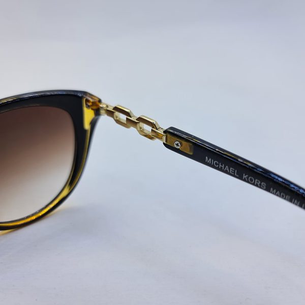 عکس از عینک آفتابی زنانه با فریم گربه ای و قهوه ای رنگ michael kors مدل 3007