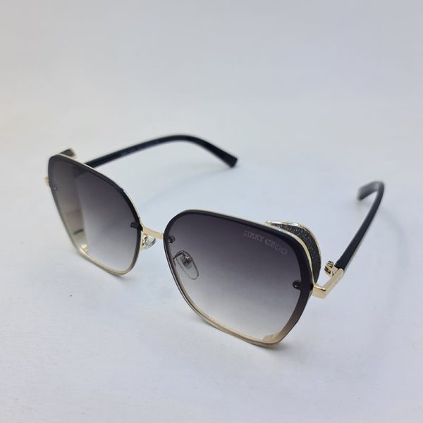 عکس از عینک آفتابی jimmy choo شاین دار با فریم طلایی و دسته مشکی رنگ مدل 28012