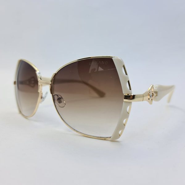 عکس از عینک آفتابی زنانه با فریم طلایی و سفید رنگ برند مورانو با عدس قهوه ای مدل 7446