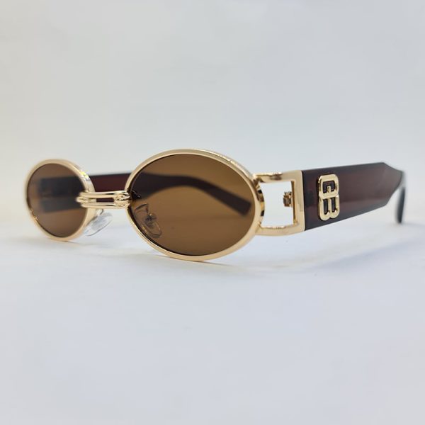 عکس از عینک آفتابی جنتل مانستر با فریم طلایی، بیضی شکل و عدسی قهوه ای مدل b2069