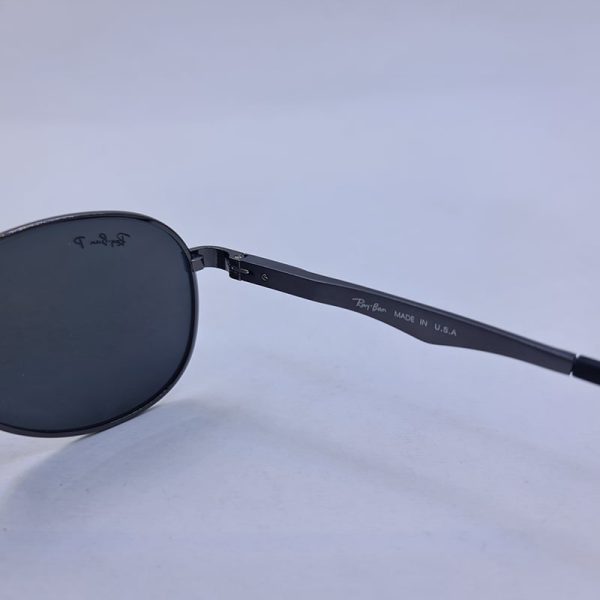 عکس از عینک آفتابی خلبانی ray-ban با فریم نوک مدادی و لنز تیره پلاریزه مدل p2033