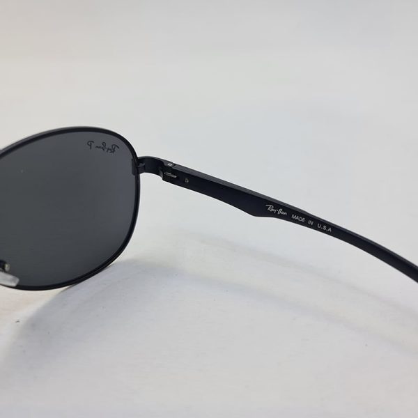 عکس از عینک آفتابی پلاریزه و خلبانی ray-ban با فریم مشکی و لنز تیره مدل p2048