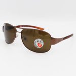 عکس از عینک آفتابی Ray-Ban با فریم مسی، خلبانی و لنز قهوه ای، پلاریزه و شیشهای مدل 3404