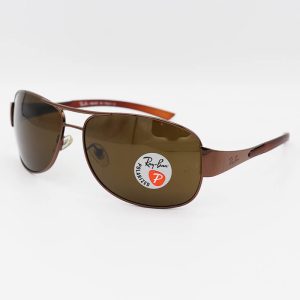 عکس از عینک آفتابی Ray-Ban با فریم مسی، خلبانی و لنز قهوه ای، پلاریزه و شیشه‌ای مدل 3404