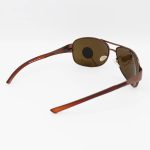 عکس از عینک آفتابی Ray-Ban با فریم مسی، خلبانی و لنز قهوه ای، پلاریزه و شیشهای مدل 3404