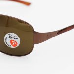 عکس از عینک آفتابی Ray-Ban با فریم مسی، خلبانی و لنز قهوه ای، پلاریزه و شیشهای مدل 3404