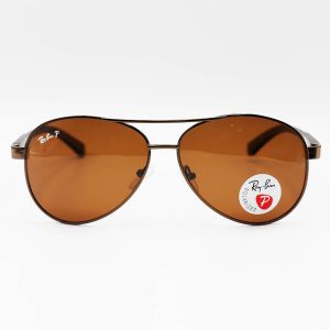 عکس از عینک آفتابی Ray-Ban با فریم خلبانی، رنگ مسی و لنز قهوه ای تیره و پلاریزه مدل P2029