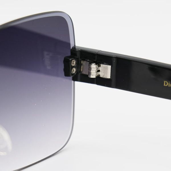 عکس از عینک آفتابی زنانه فریم‌لس با دسته مشکی و لنز سایه روشن dior مدل d2328